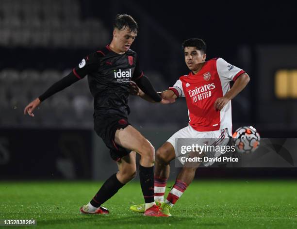 Salah Oluad M'hand of Arsenal is challenged by Jamie Andrews of West Bromwich Albion during the Premier League Cup match between Arsenal U23 and West...