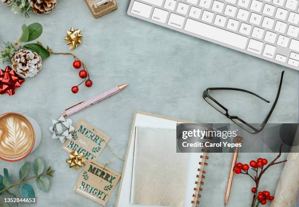 feminine desktop workspace with computer keyboard and christmas items - holiday table stock pictures, royalty-free photos & images