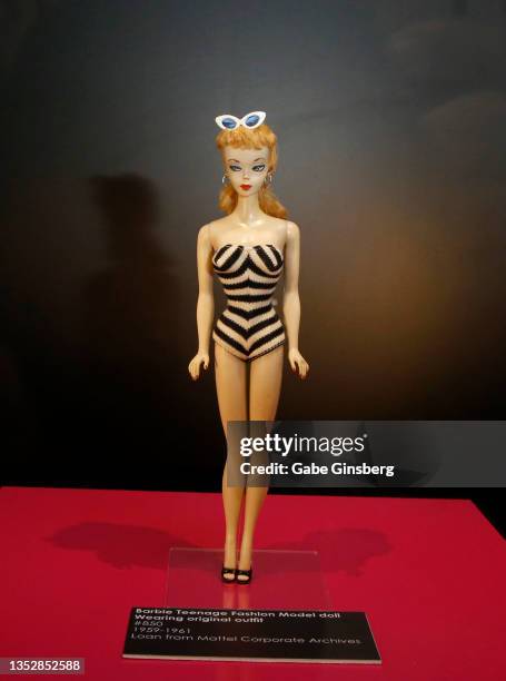 The first Barbie doll from 1959 called the Barbie Teenage Fashion Model doll is displayed during the Barbie: A Cultural Icon Exhibition media and VIP...