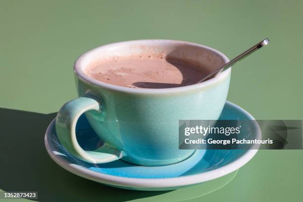 cup of warm chocolate with spoon - cup celebration stock pictures, royalty-free photos & images