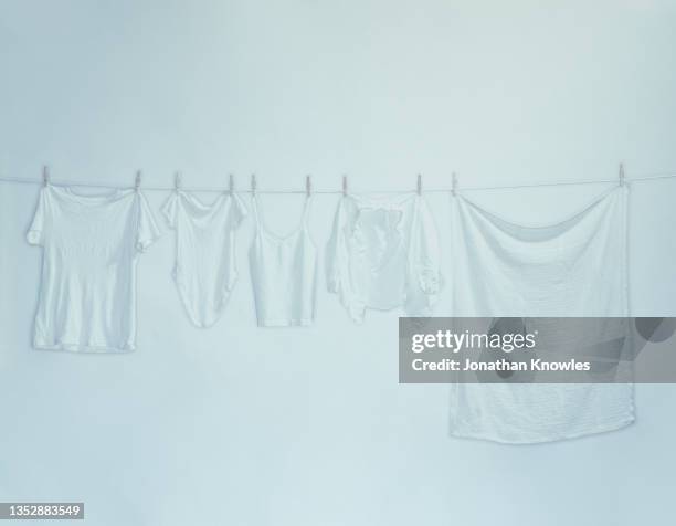 white clothes hanging on clothesline - draped sheet stock pictures, royalty-free photos & images