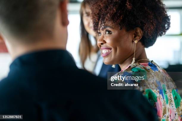 close-up of a smiling woman with colleagues in the office - head of policy stock pictures, royalty-free photos & images