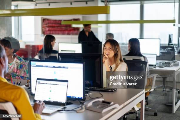 people working in coworking office space - fintech imagens e fotografias de stock