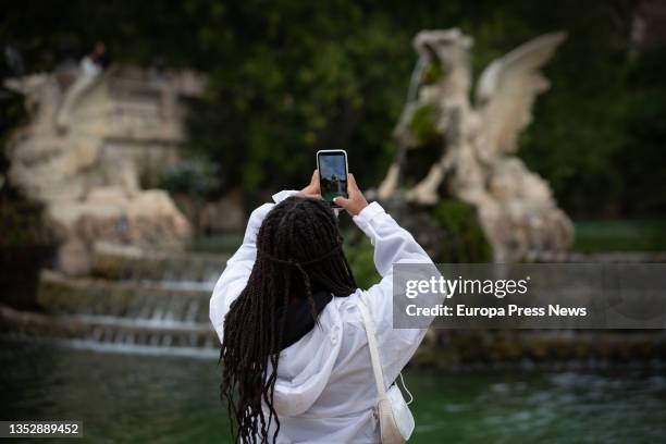 Woman takes pictures with her mobile phone in the Parc de la Ciutadella, on November 12 in Barcelona, Catalonia, Spain. Catalonia has again been...