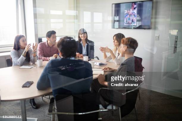 businesspeople having meeting inside office boardroom - internal communication stock pictures, royalty-free photos & images