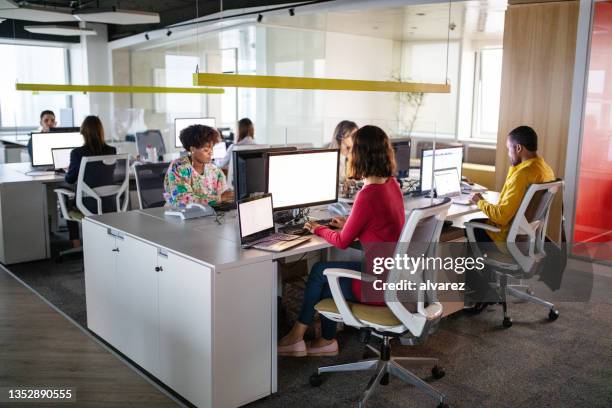 people working in coworking office space - office door open stockfoto's en -beelden