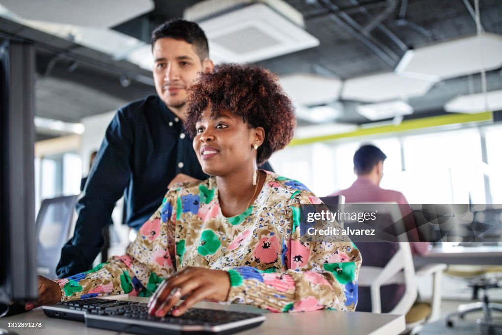 Multiple People Working Two Business People Working Together In A Computer In Office High-Res ...