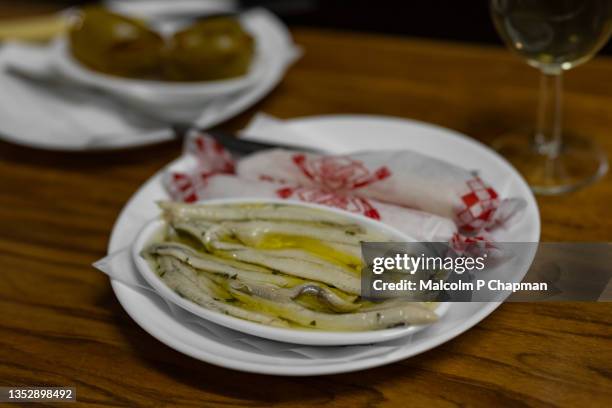 tapas - anchovy fillets in olive oil - córdoba spanje stockfoto's en -beelden
