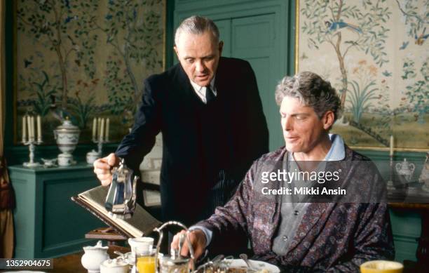 View of Welsh actor Sir Anthony Hopkins and American actor Christopher Reeve during the filming of 'The Remains of the Day' at Corsham Court,...