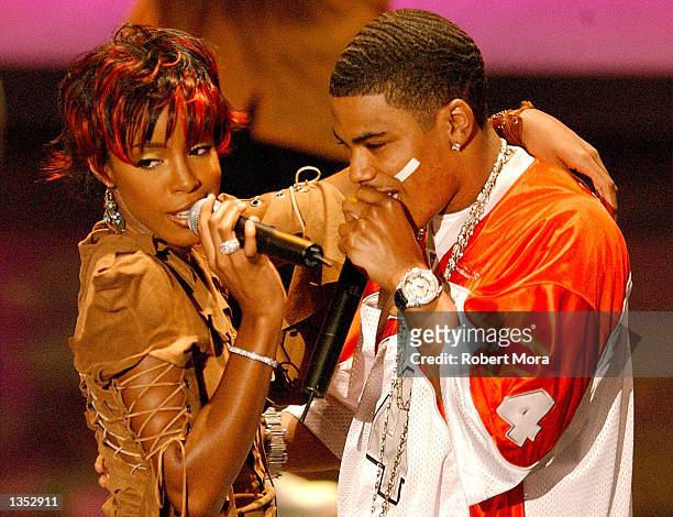 Singer Kelly Rowland and rapper Nelly perform on stage during the 8th Annual Soul Train Lady of Soul Awards at the Pasadena Civic Auditorium August...