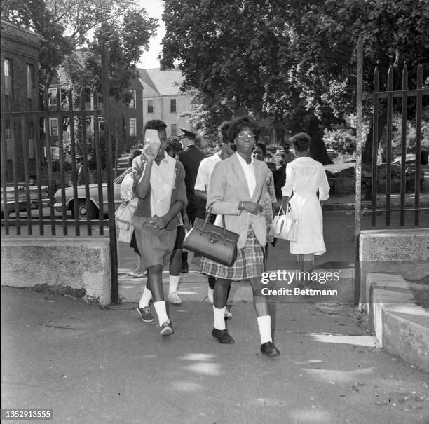 Two Black students enter the Patrick T. Campbell High School to attend classes. Black leaders, who called a protest against "de facto segregation" in...