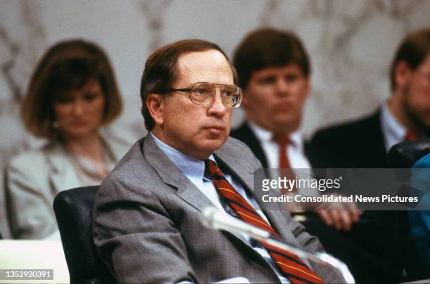 Senator Sam Nunn, chair of Senate Permanent Subcommittee on Investigations, listens to witnesses testify during a hearing on Capitol Hill, Washington...
