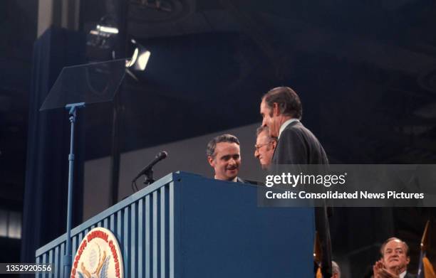 View of, from left, US Senator Thomas Eagleton , Democratic National Convention chair Lawrence F O'Brien , and US Senator George McGovern at podium...