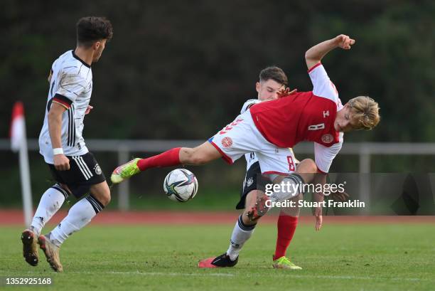 Umut Tohumcu of Germany is challenged by Alexander Lyng of Denmark during an U18's friendly match between Germany and Denmark at BSA...