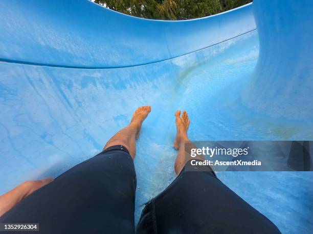 pov going down a water slide - waterslide stock pictures, royalty-free photos & images