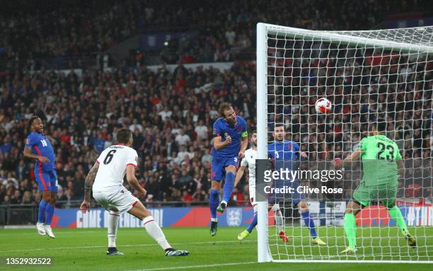 Harry Kane of England scores their side's second goal past Thomas Strakosha of Albania during the 2022 FIFA World Cup Qualifier match between England...