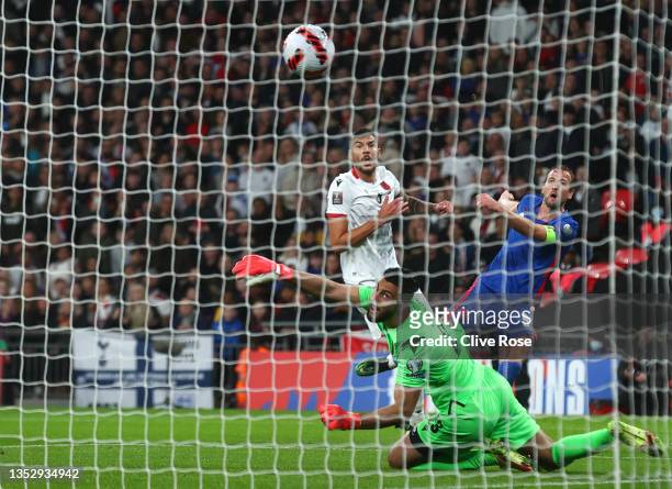 Harry Kane of England scores their side's fourth goal past Thomas Strakosha of Albania during the 2022 FIFA World Cup Qualifier match between England...