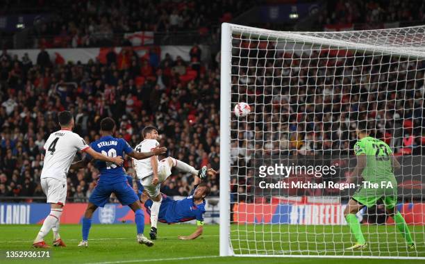Harry Kane of England scores their side's fifth goal and his hat-trick past Thomas Strakosha of Albania during the 2022 FIFA World Cup Qualifier...