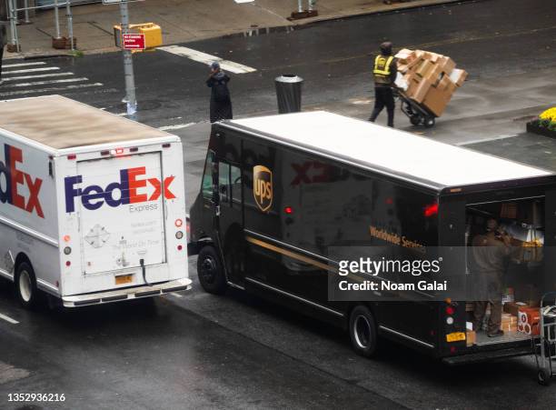 And FedEx workers deliver packages on the Upper West Side on November 12, 2021 in New York City.