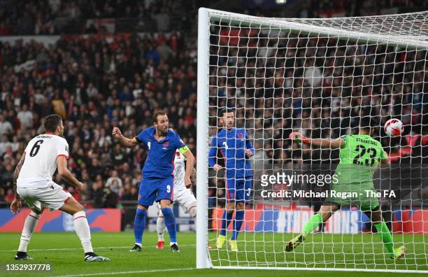 Harry Kane of England scores their side's second goal past Thomas Strakosha of Albania during the 2022 FIFA World Cup Qualifier match between England...