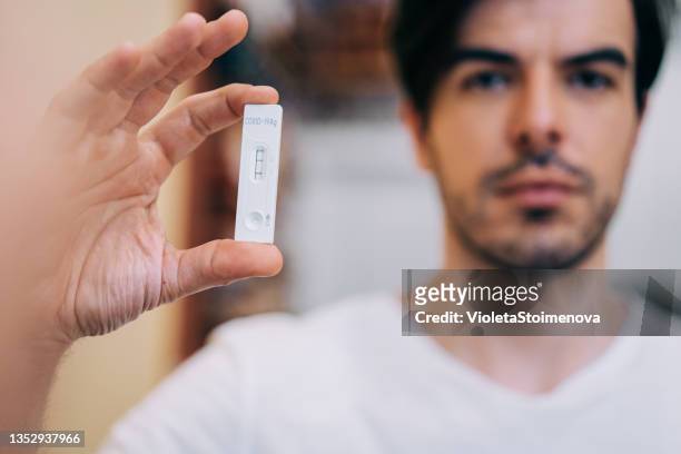 positive test result by using rapid test device for covid-19. - bulgaria coronavirus stock pictures, royalty-free photos & images