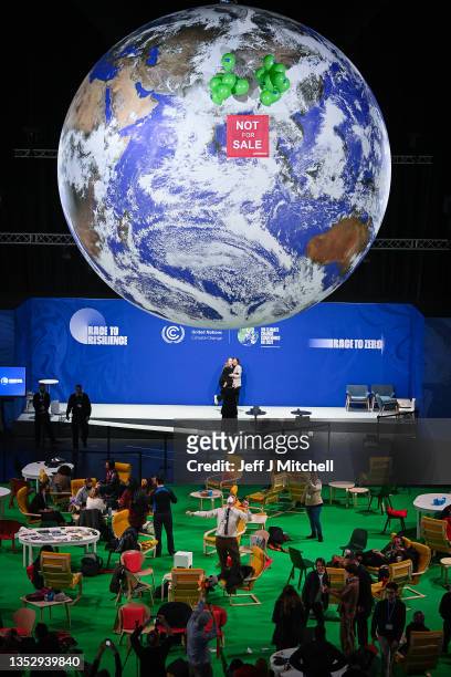 Greenpeace activists hold a protest in the action zone on November 12, 2021 in Glasgow, Scotland. Climate negotiations should be reaching the end...