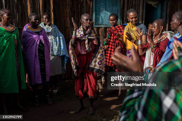 Community-based church group of women meets to dance and sing at a member's home on the edge of the Kirisia forest on August 14 close to the town of...