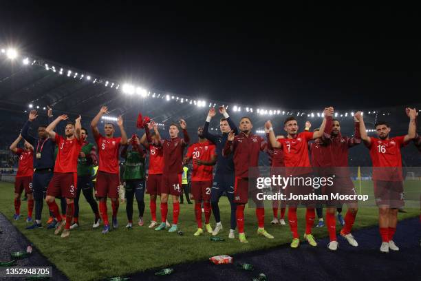 Switzerland players salute their fans following the final whistle of the 2022 FIFA World Cup Qualifier match between Italy and Switzerland at Stadio...