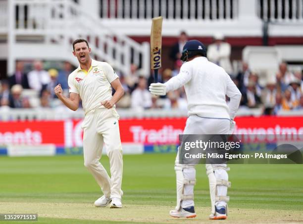 Australia's Josh Hazlewood celebrates the wicket of England's Jonny Bairstow during day three of the second Ashes test match at Lord's, London....