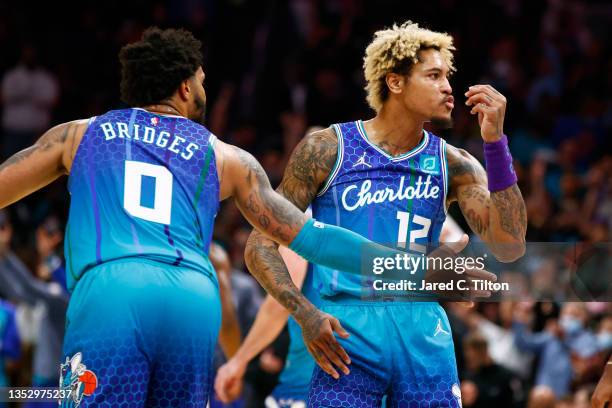 Kelly Oubre Jr. #12 of the Charlotte Hornets reacts following a three point basket during the second half of their game against the New York Knicks...