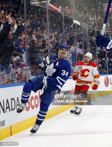 Auston Matthews of the Toronto Maple Leafs scores he game winning goal at 2:32 of overtime against the Calgary Flames at the Scotiabank Arena on...