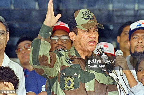 General Manuel Antonio Noriega speaks 20 May 1988 in Panama City during the presentation of colors to the San Miguel Arcangel de San Miguelito...