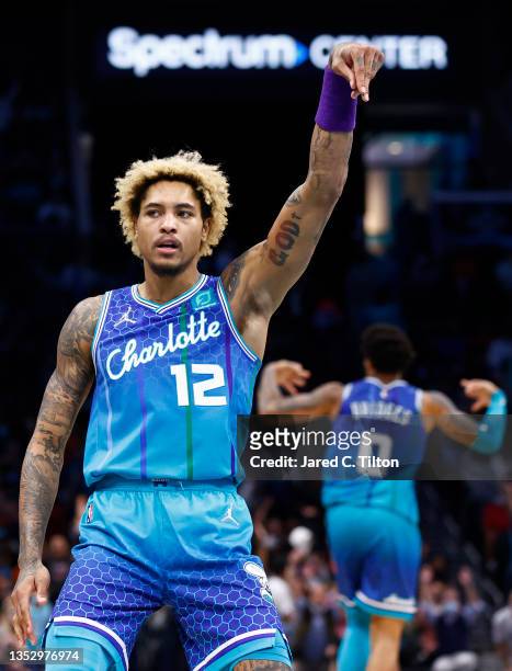 Kelly Oubre Jr. #12 of the Charlotte Hornets reacts following a three point basket during the second half of their game against the New York Knicks...