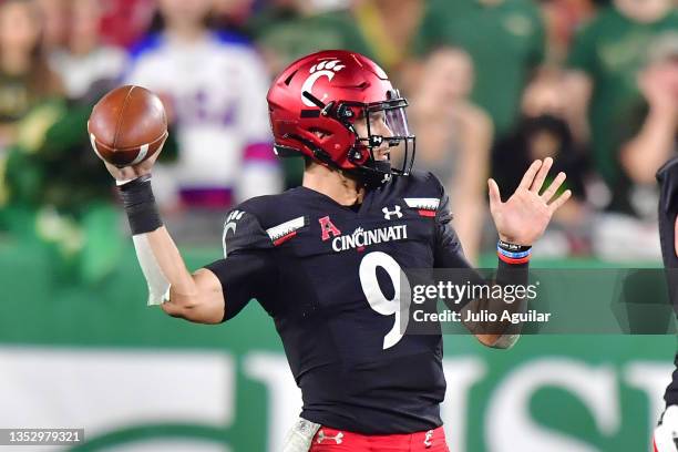 Desmond Ridder of the Cincinnati Bearcats drops back to throw a pass in the third quarter against the South Florida Bulls at Raymond James Stadium on...