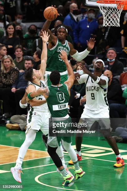 Robert Williams III of the Boston Celtics blocks a shot against the Milwaukee Bucks during overtime at TD Garden on November 12, 2021 in Boston,...
