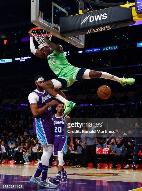 Jarred Vanderbilt of the Minnesota Timberwolves makes a slam dunk against Anthony Davis of the Los Angeles Lakers in the first quarter at Staples...