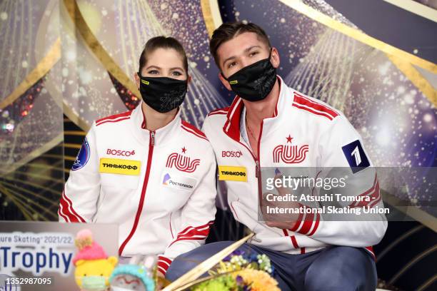 Anastasia Mishina and Aleksandr Galliamov of Russia pose for photographs at the kiss and cry after competing in the Pair Free Skating during the ISU...