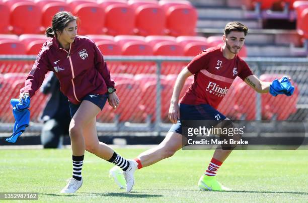 Matilda Comley and Josh Cavallo of Adelaide United during a joint A-League United A-League Men's & Women's team training session at Coopers Stadium...