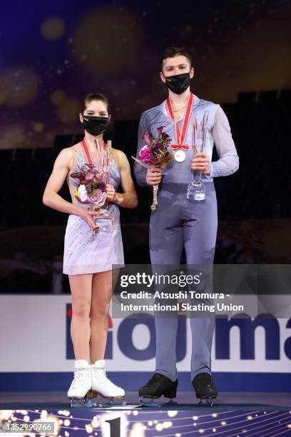 Gold medalists Anastasia Mishina and Aleksandr Galliamov of Russia pose on the podium at the medal ceremony for the Pair event during the ISU Grand...