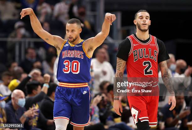 Stephen Curry of the Golden State Warriors reacts after Andrew Wiggins of the Golden State Warriors made a basket against the Chicago Bulls in the...