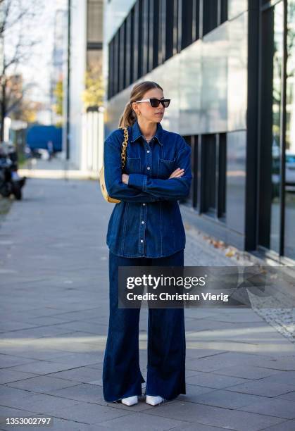 Aline Kaplan is seen wearing Denim Look: Source Unknown, beige bag PECO Handbag, sunglasses Celine, white heels Zara on November 12, 2021 in Berlin,...