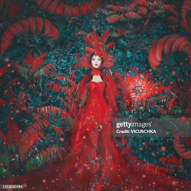 woman in elegant red dress with headdress at red and blue abstract background with floral pattern - blue dress stock pictures, royalty-free photos & images