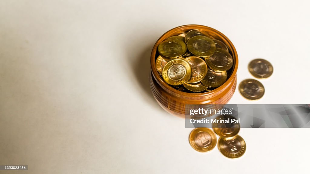 Stack of Indian 10 rupee currency coins on a white background