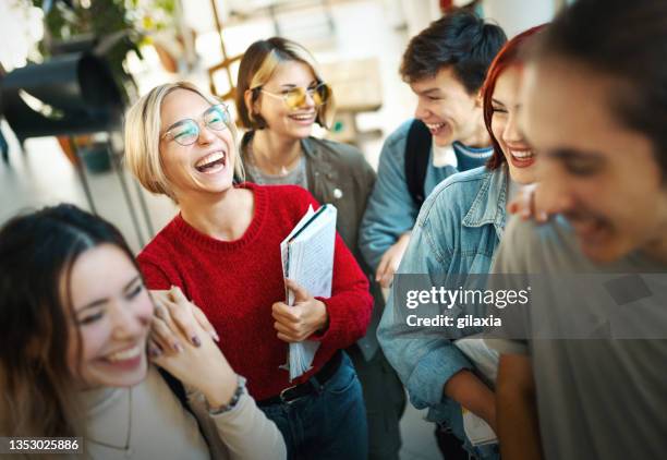 highschool students on a break in  the hallway. - fun student stockfoto's en -beelden