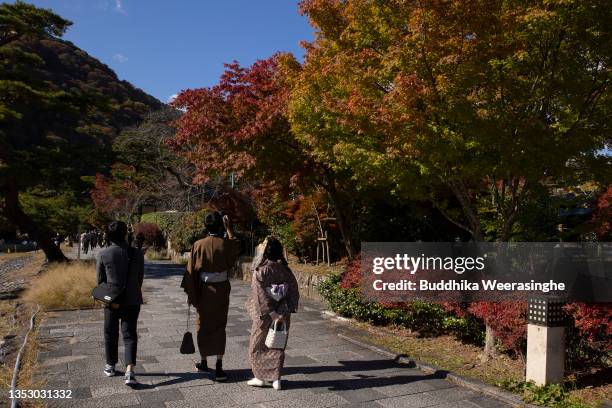 Tourist visit to observe fall foliage at Arashiyama, one of Kyoto’s most popular tourist destinations, on November 13, 2021 in Kyoto, Japan. Fall...