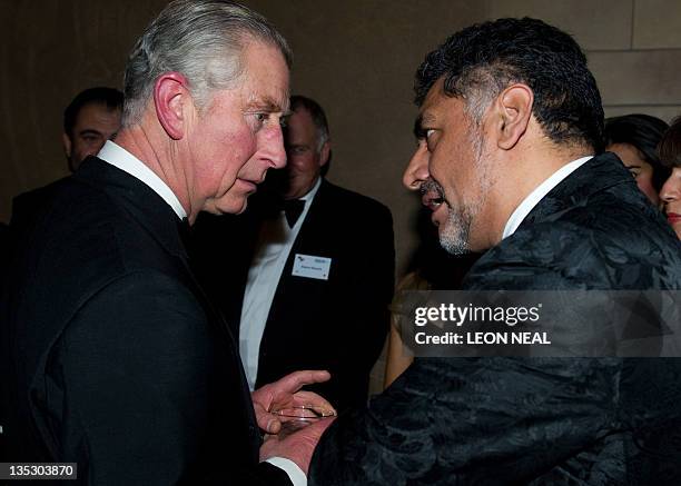 The Prince of Wales speaks with with Pakistani entrepreneur and television personality James Caan at a dinner in the Natural History Museum, London...