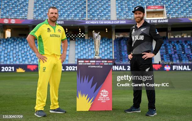 Rival captains Aaron Finch of Australia and Kane Williamson of New Zealand pose with the T20 World Cup trophy prior to the ICC Men's T20 World Cup...