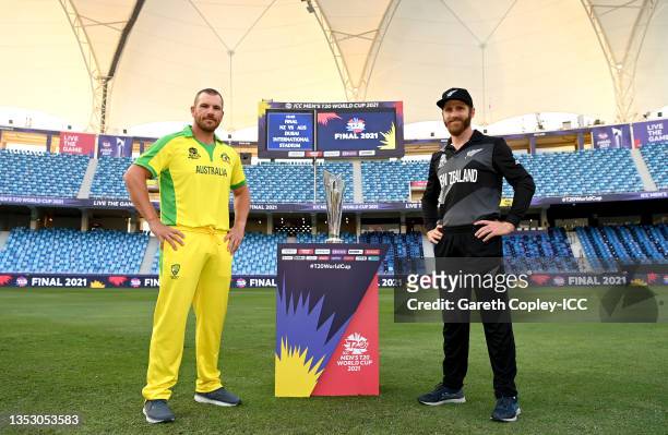 Rival captains Aaron Finch of Australia and Kane Williamson of New Zealand pose with the T20 World Cup trophy prior to the ICC Men's T20 World Cup...