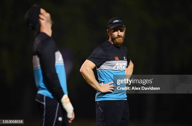 Kane Williamson of New Zealand interacts with Devon Conway during a New Zealand Net Session ahead of the ICC Men's T20 World Cup final match between...