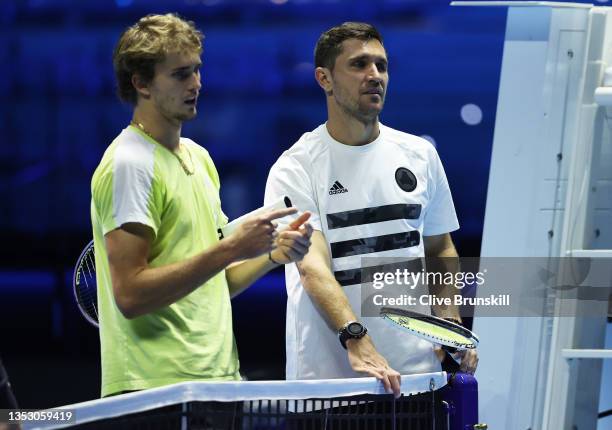 Alexander Zverev of Germany with his coach and brother Mischa Zverev during a practice session ahead of the Nitto ATP Tour Finals at Pala Alpitour on...